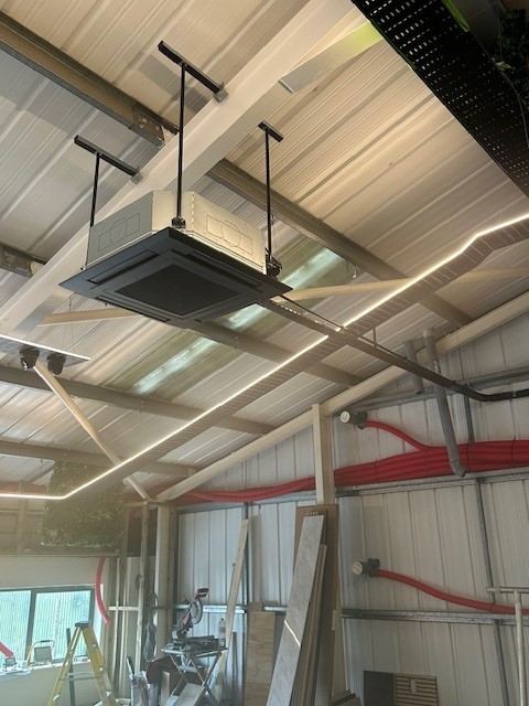 Ceiling cassette air conditioning system in a commercial workshop, Gloucestershire